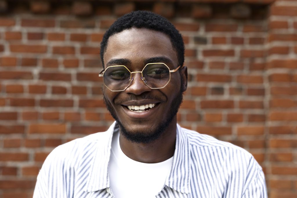 close up smiley man with glasses (1)